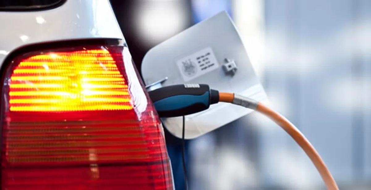 Electric car plugged into EV charger after professional installation in Austin, TX