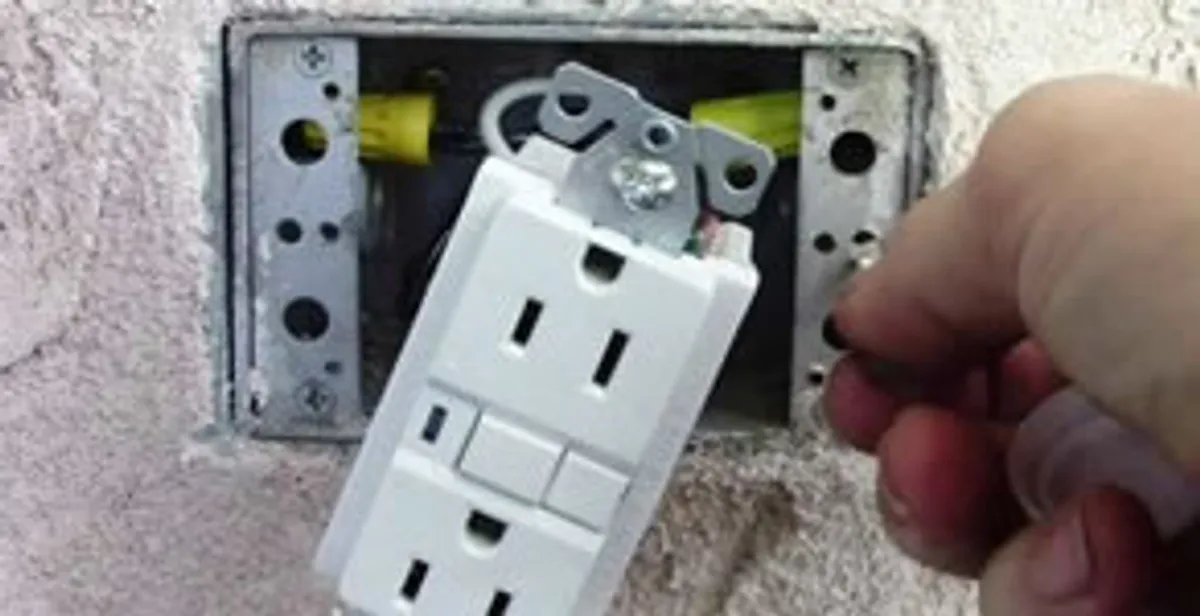 gfci circuits service showing installation of a ground fault circuit interrupter outlet by licensed electricians in Austin, TX