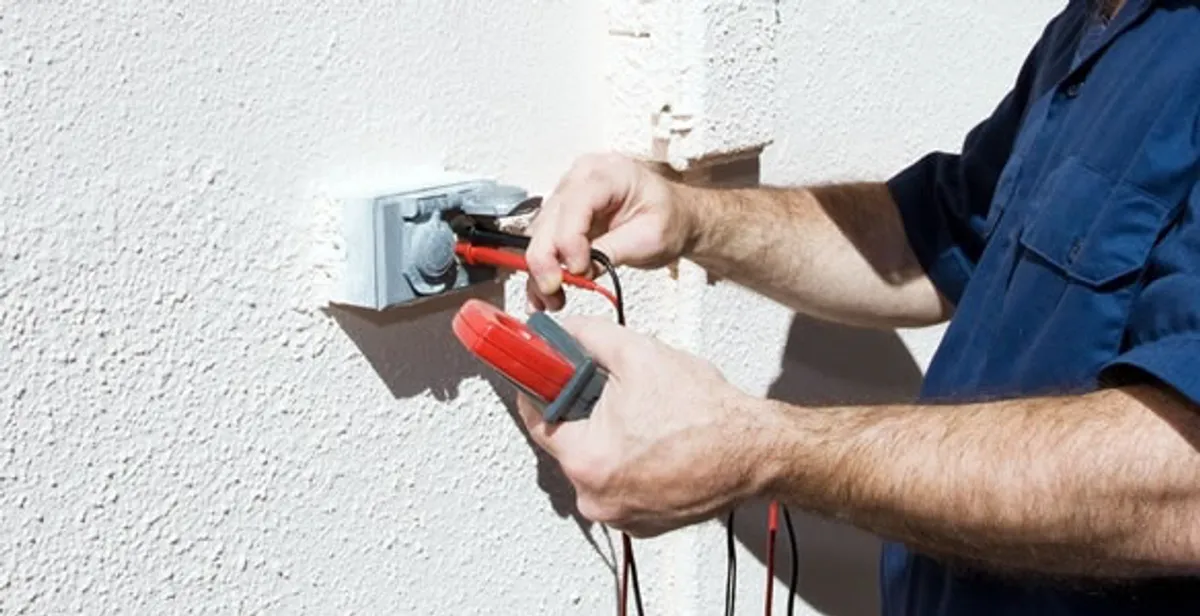 Electrician performing home electrical outlet and wiring inspection in Austin, TX